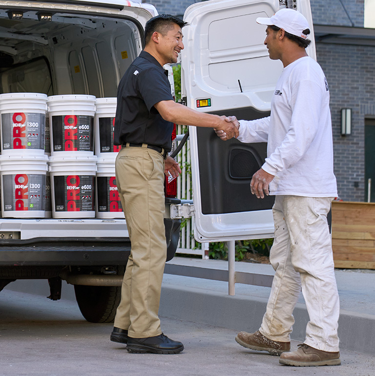 A Behr Pro Rep shaking hands with a Pro Contractor